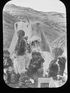 Image of Inuit family by  tupik. Baby in hood